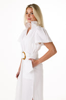 A women modeling a white short sleeve dress with a high collar against a white background