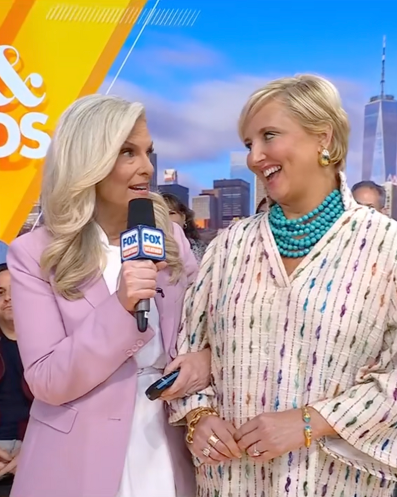 Two women on a TV set with 'FOX & FRIENDS' branding and a cityscape in the background.
